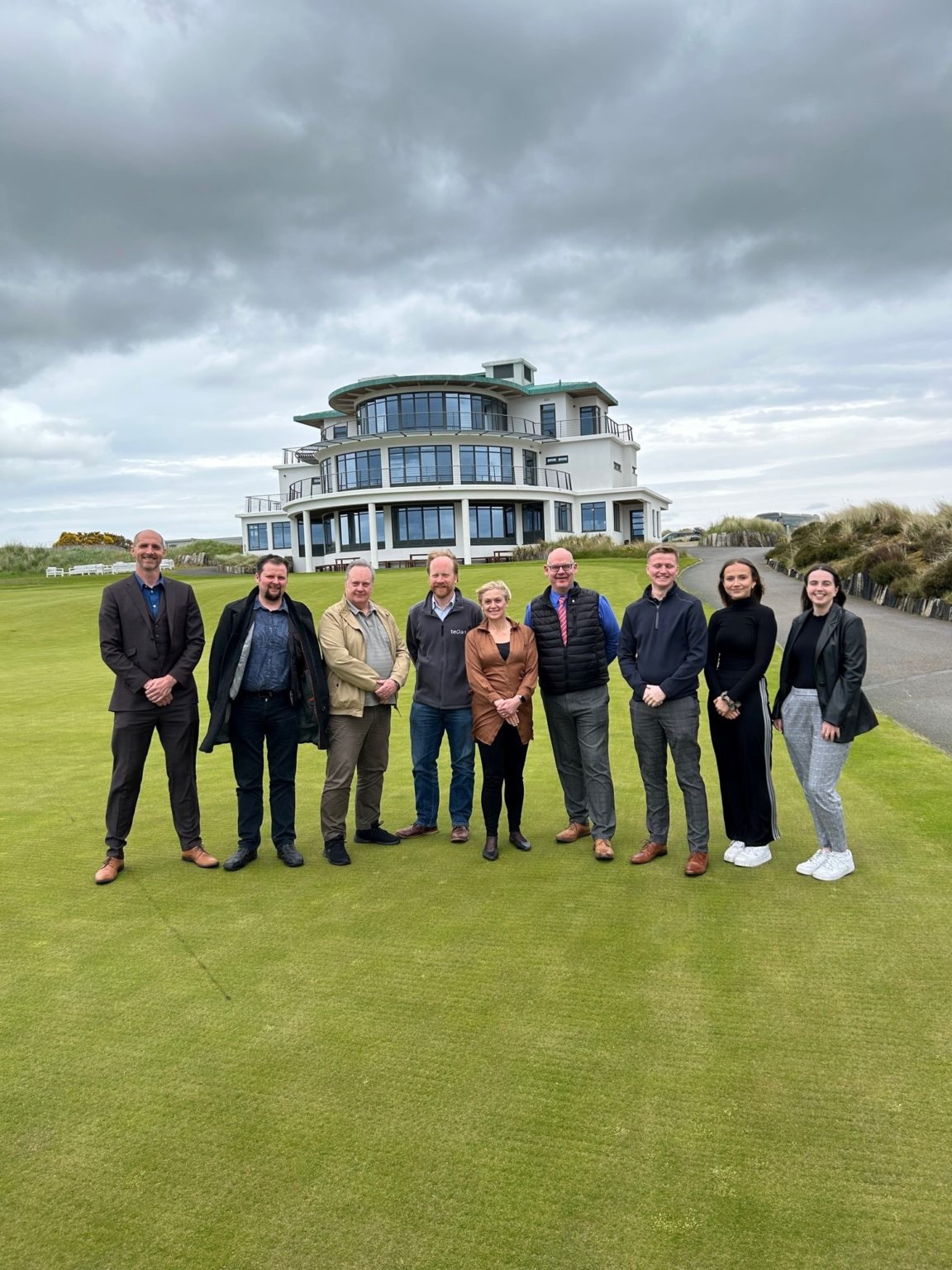 Image of the team of digital marketing experts outside Castle Stuart